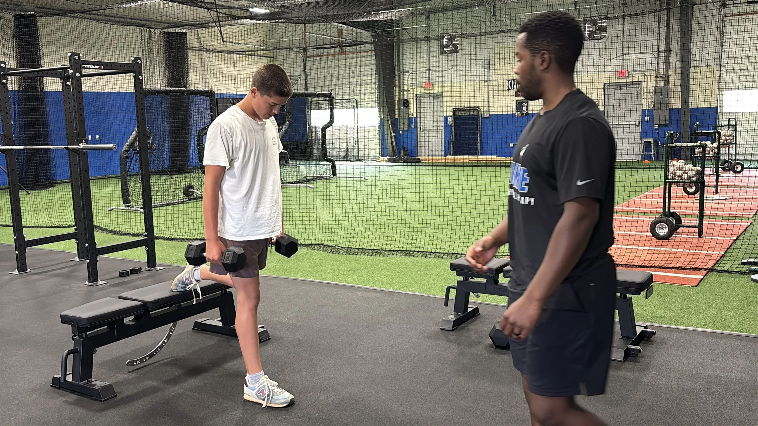 Patient working with a provider at a sports physical therapy clinic in West Chester, PA reviewing force plate testing results