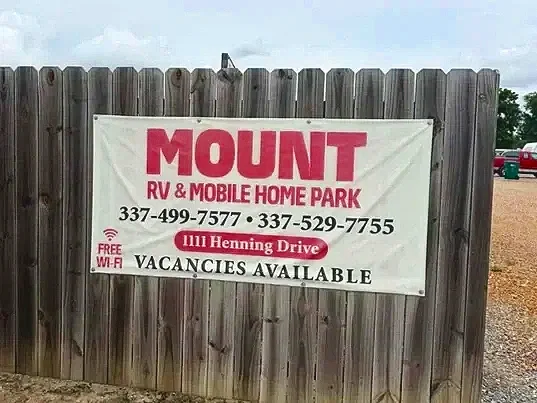 Sign for Mount RV and Mobile Home Park with contact information, location, and Wi-Fi availability.