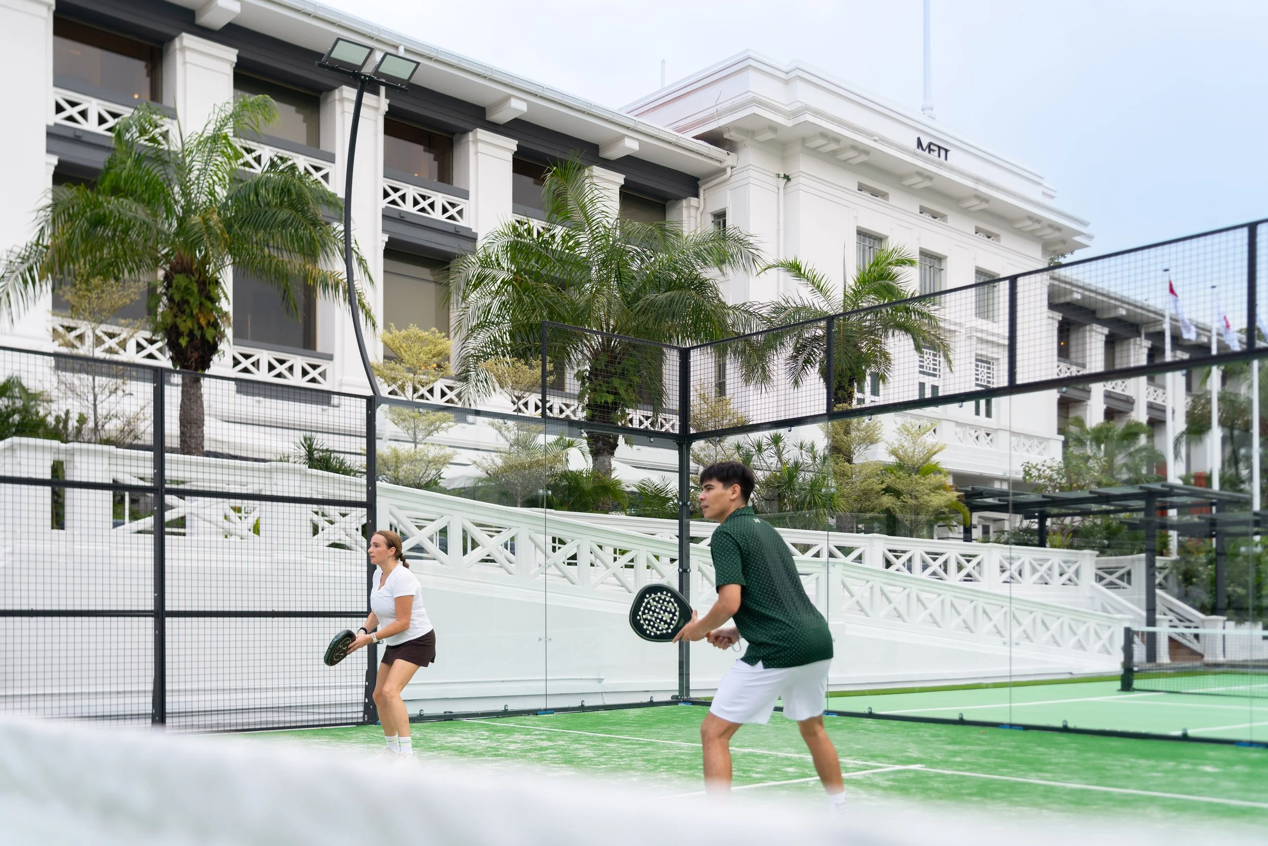 METT Singapore Hotel pickleball courts and facade. 