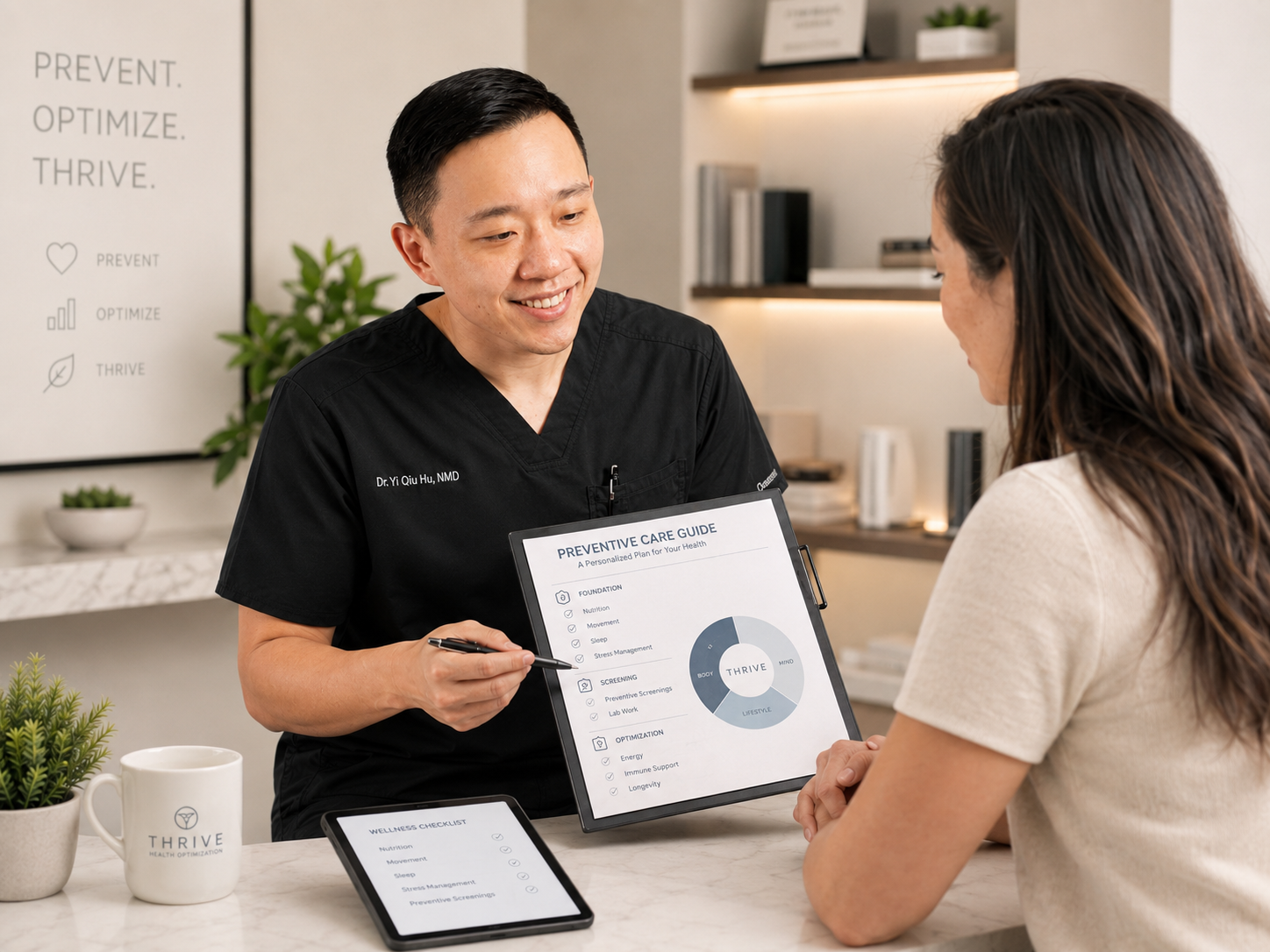 Dr. YiQiu Hu discussing preventive healthcare and long-term health optimization with a patient in Arizona