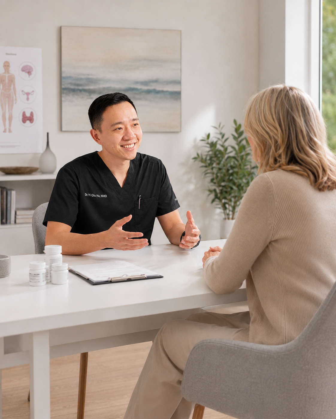 Dr. YiQiu Hu reviewing laboratory test results with a patient before hormone replacement therapy