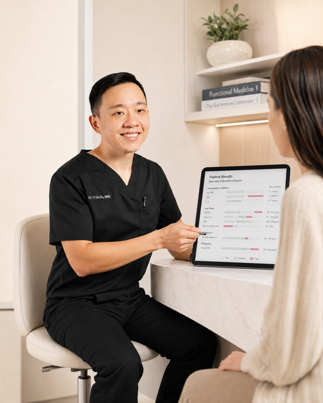 A doctor in black scrubs showing a medical report on a tablet to a female patient in a consultation room.