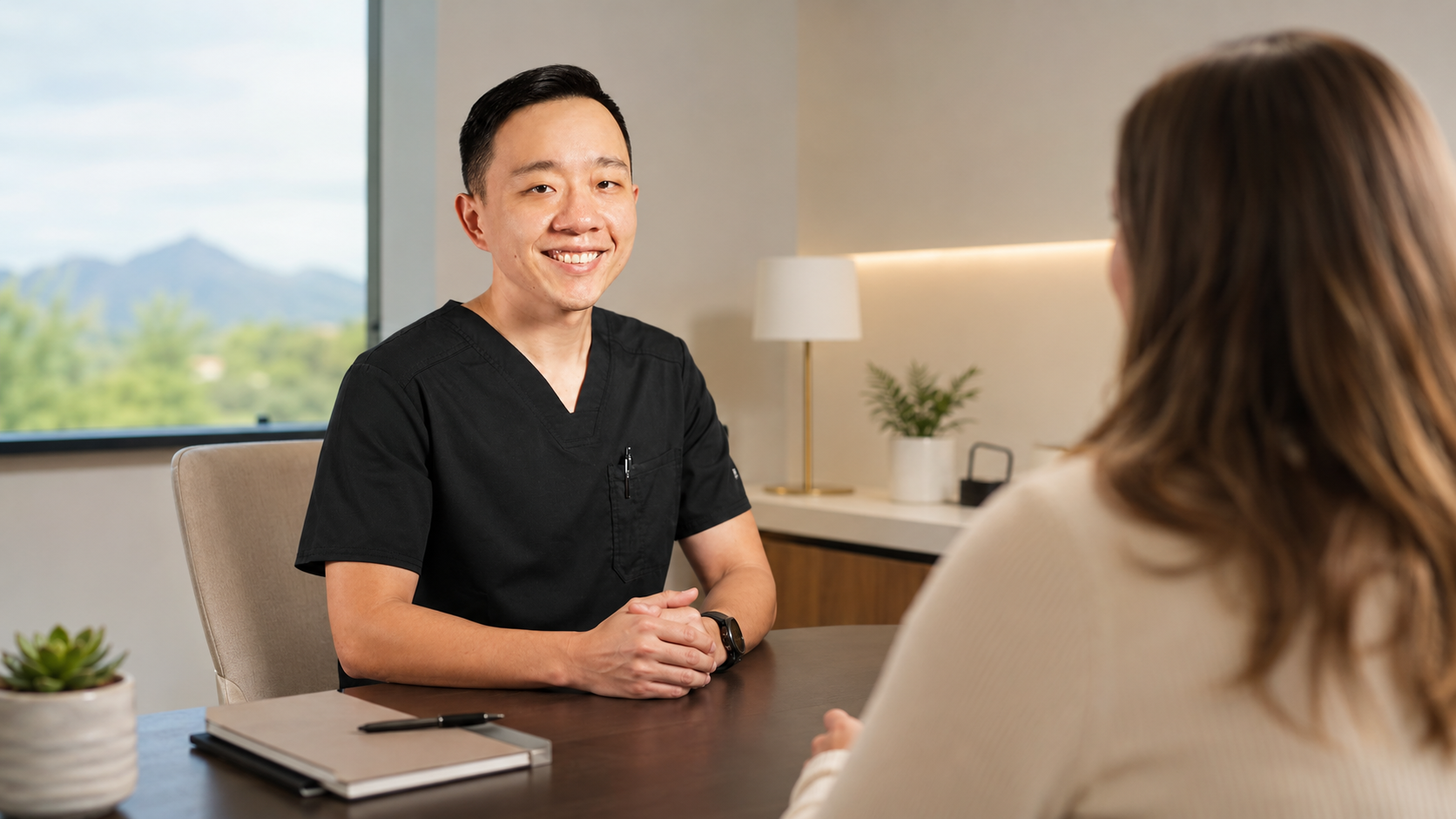 Concierge physician discussing membership services and healthcare expectations with a patient in Arizona