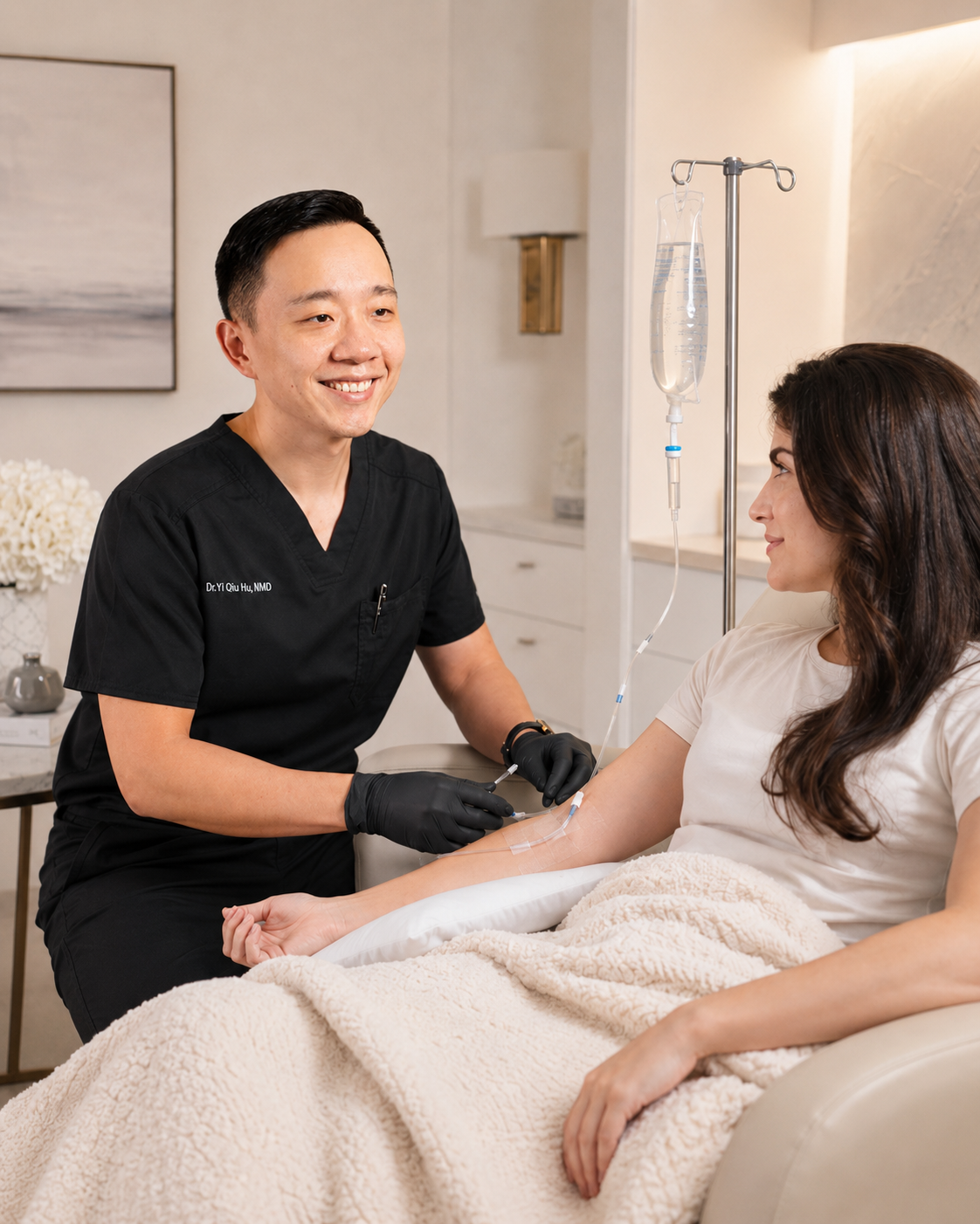 Doctor preparing to draw blood from a patient's arm in a medical setting.