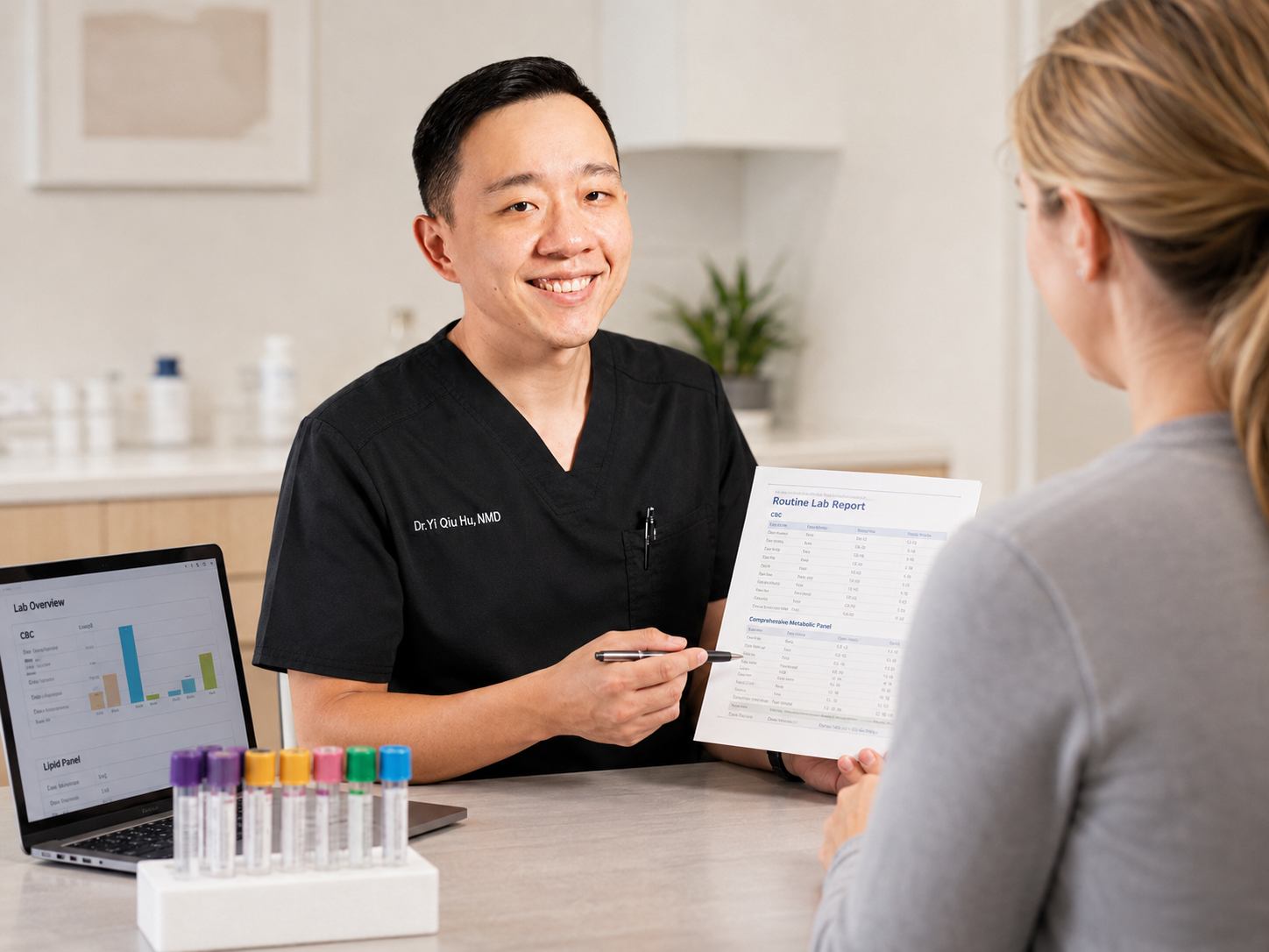 Dr. Hu reviewing routine blood work and laboratory test results with a patient
