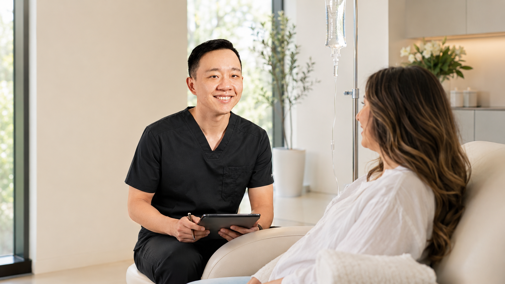Dr. Hu reviewing IV therapy options and safety considerations with a patient