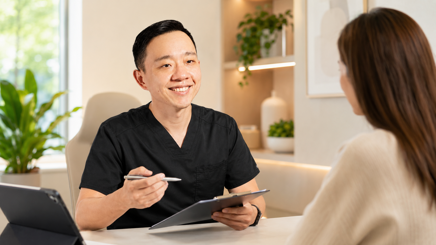 Dr. YiQiu Hu discussing the benefits and costs of concierge medicine with a patient in Arizona