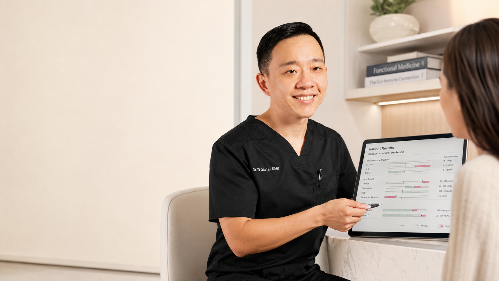 Doctor smiling and explaining medical test results displayed on a tablet to a patient in a clinical setting.