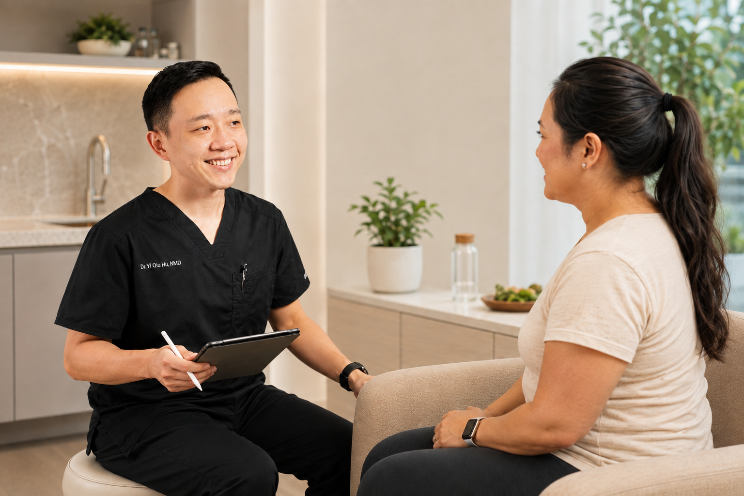 Dr. YiQiu Hu discussing a personalized medical weight loss plan with a patient in Arizona