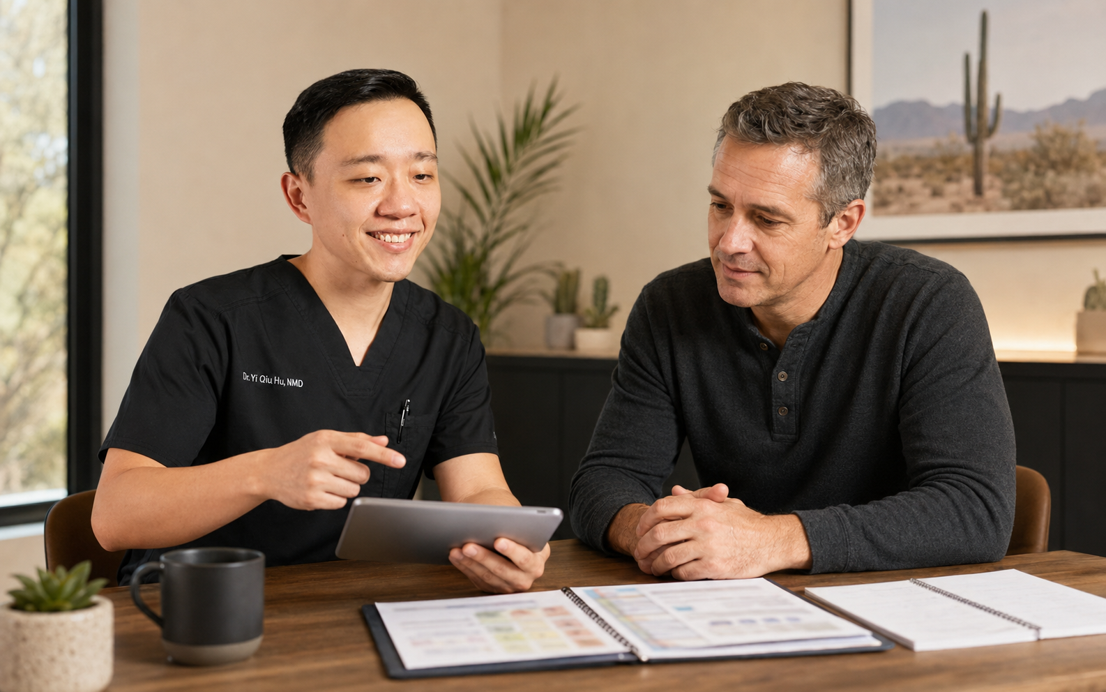 Concierge physician reviewing laboratory results and specialist recommendations with a patient
