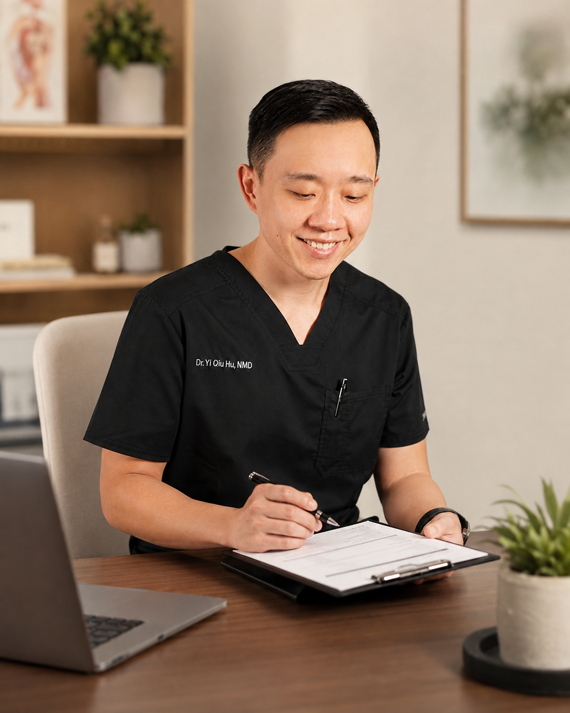 Dr. Hu reviewing medical records and documentation during a physician-guided evaluation