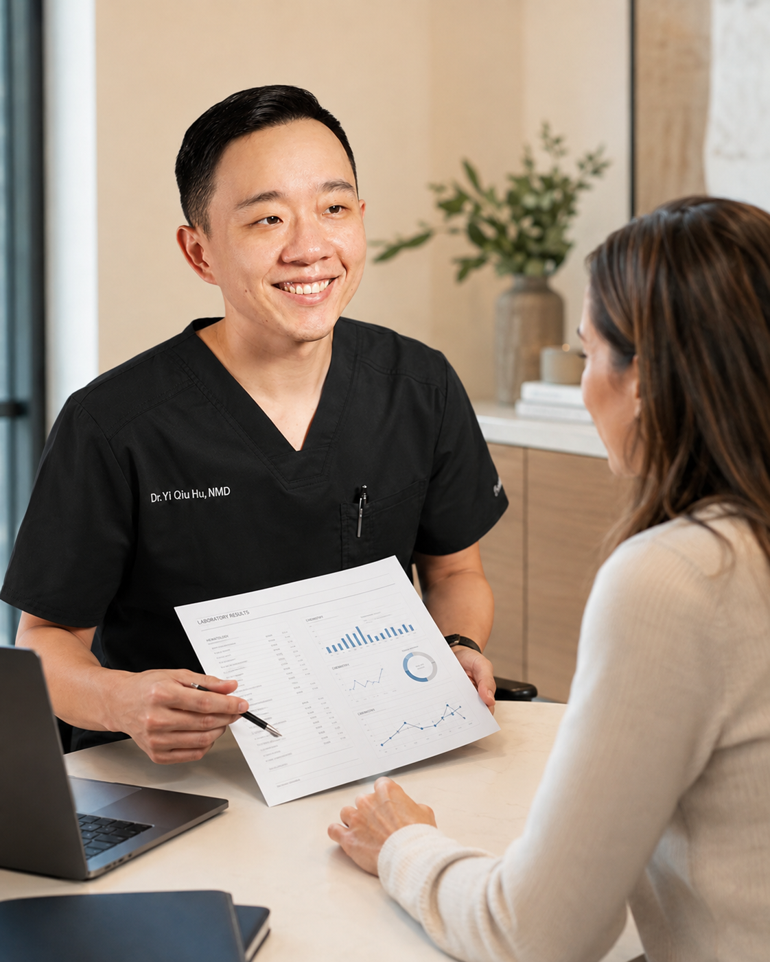Dr. Hu reviewing specialty laboratory results with a patient