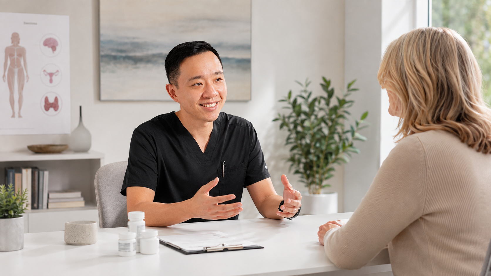 Dr. YiQiu Hu reviewing laboratory test results with a patient before hormone replacement therapy