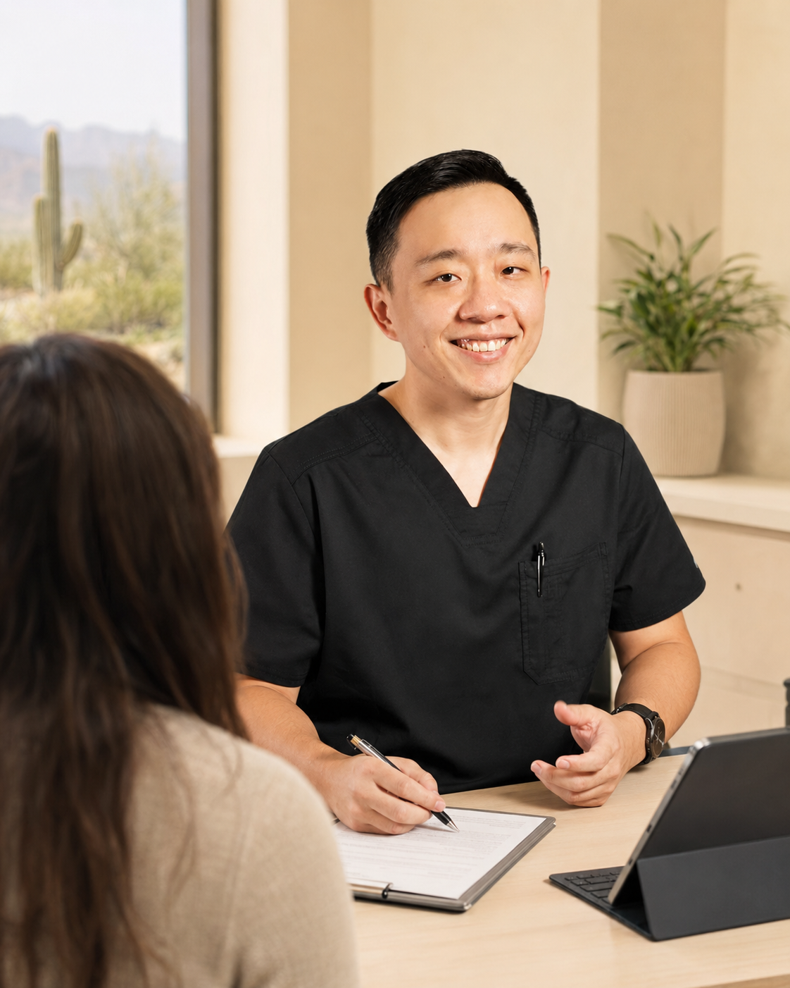Dr. Hu discussing Arizona medical marijuana certification with a patient