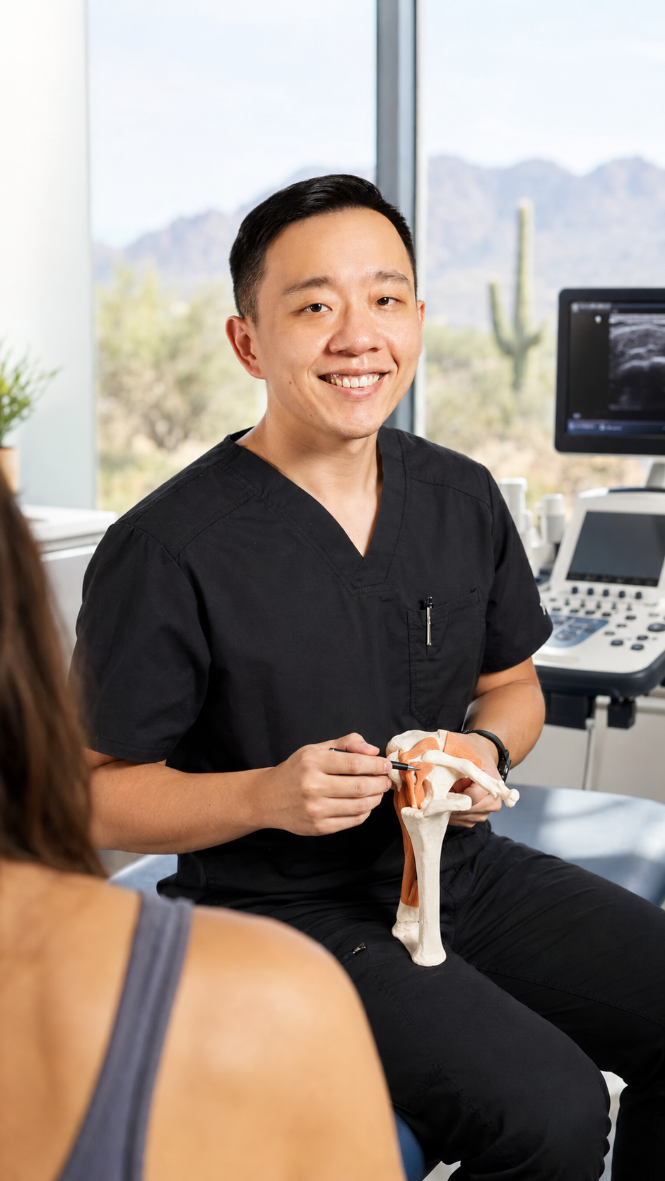 Physician discussing personalized integrative pain management options with a patient in Arizona