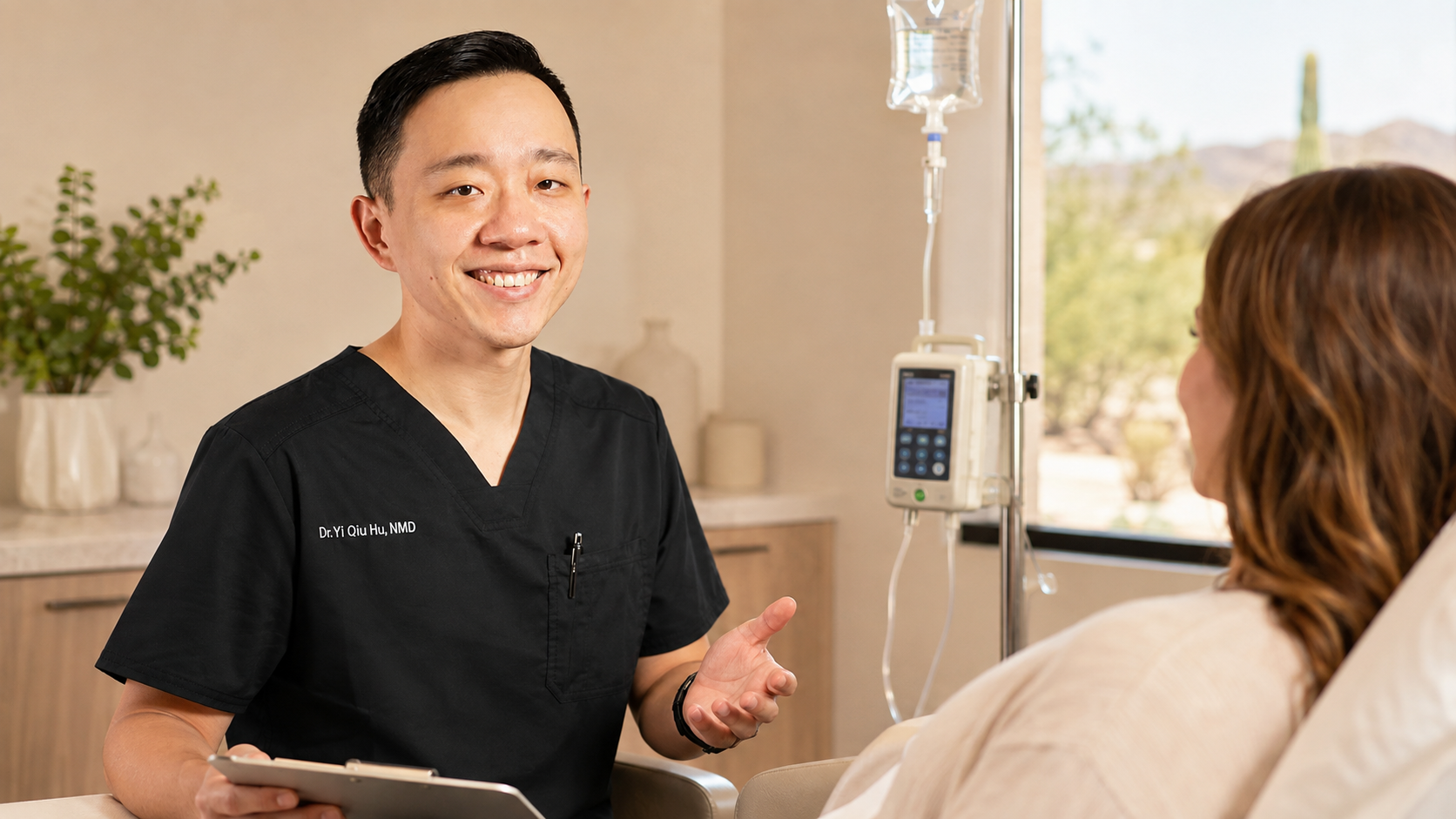 Dr. YiQiu Hu discussing physician-guided IV therapy with a patient in Arizona