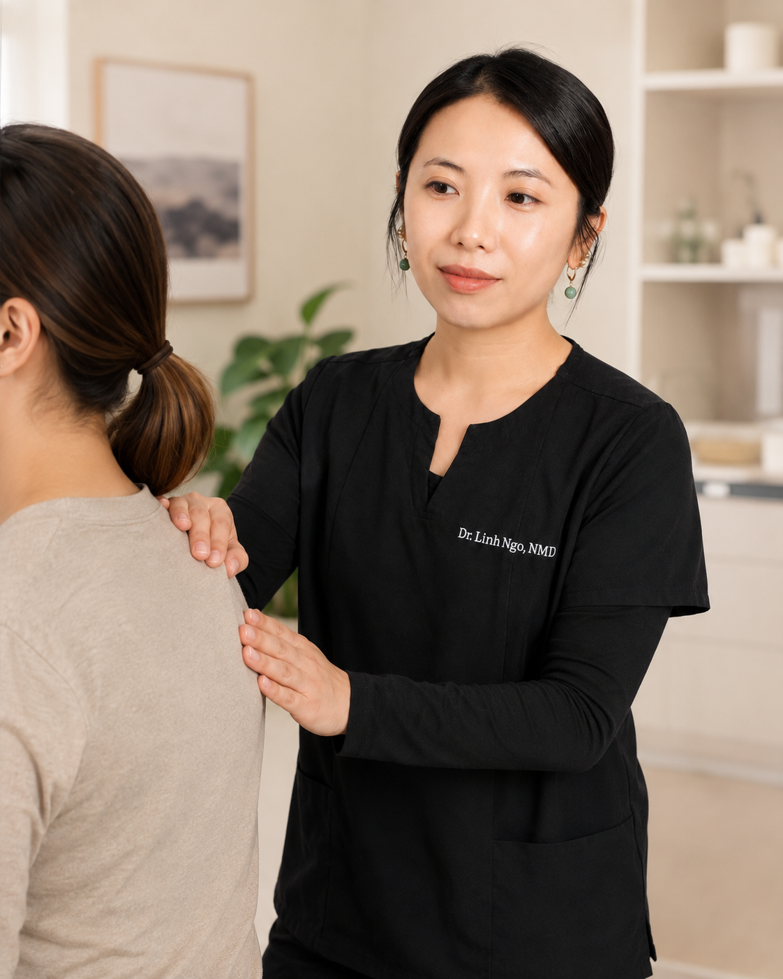 Dr. Linh Ngo evaluating a patient during an integrative pain management appointment in Phoenix, Arizona
