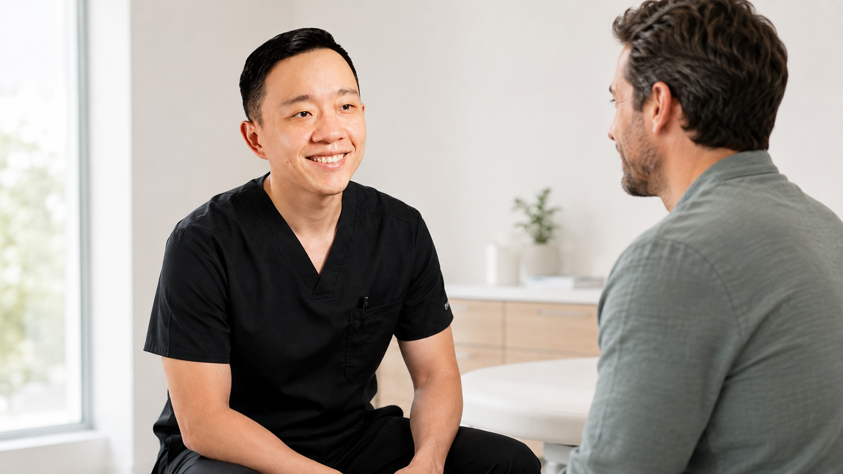Dr. YiQiu Hu discussing testosterone replacement therapy with a male patient in Arizona