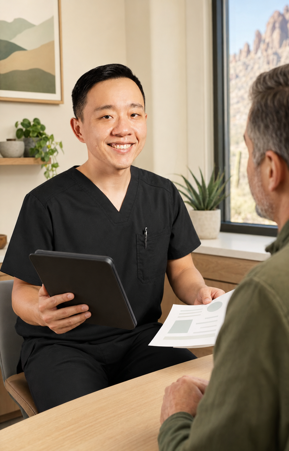 Physician reviewing medical records during an Arizona medical marijuana evaluation