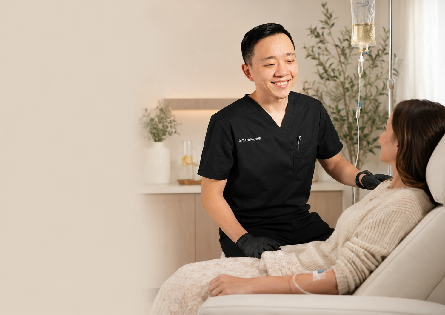 Dr. YiQiu Hu monitoring a patient receiving personalized IV therapy