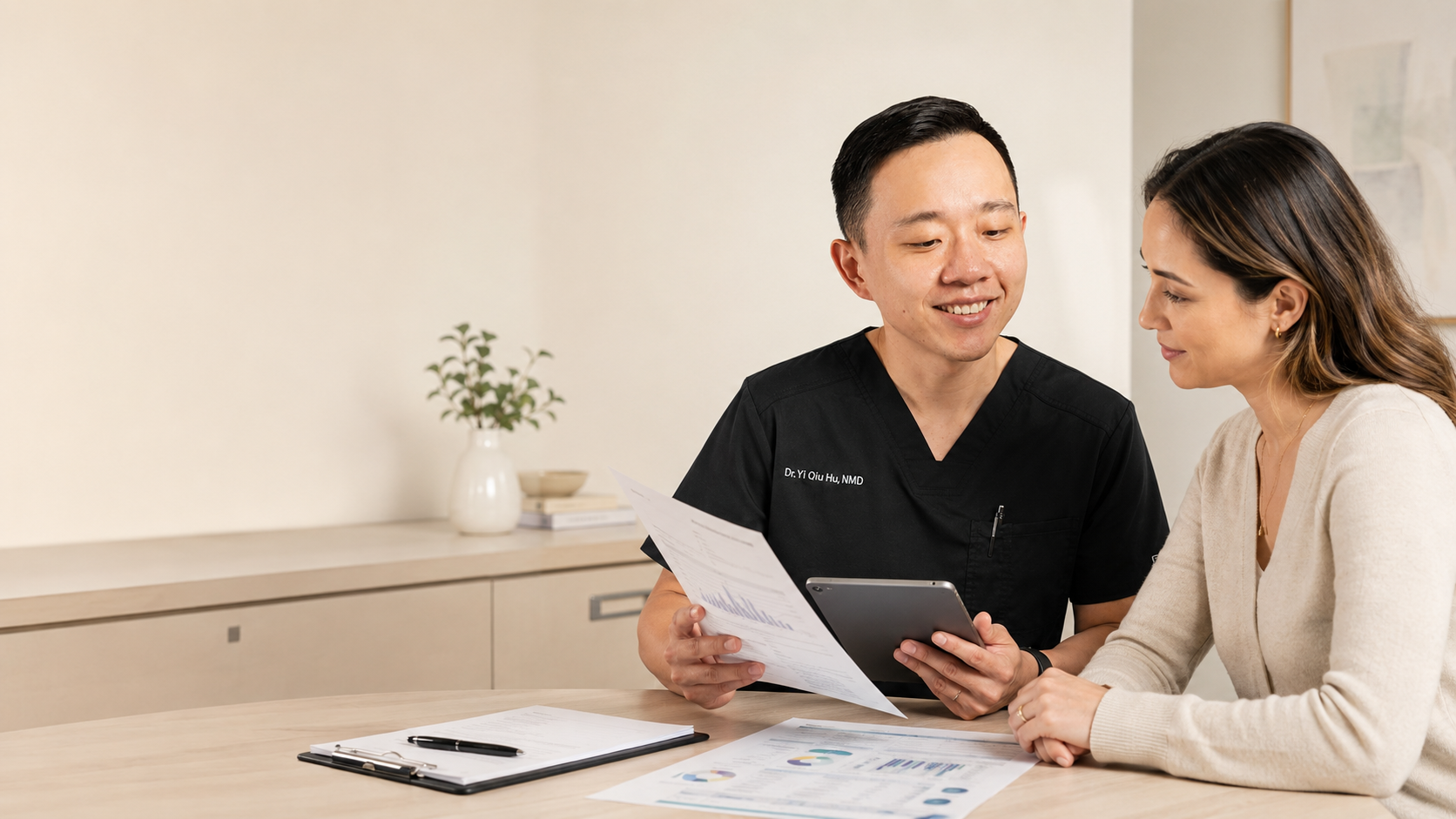 Dr. Hu reviewing specialty laboratory test results with a patient in Arizona