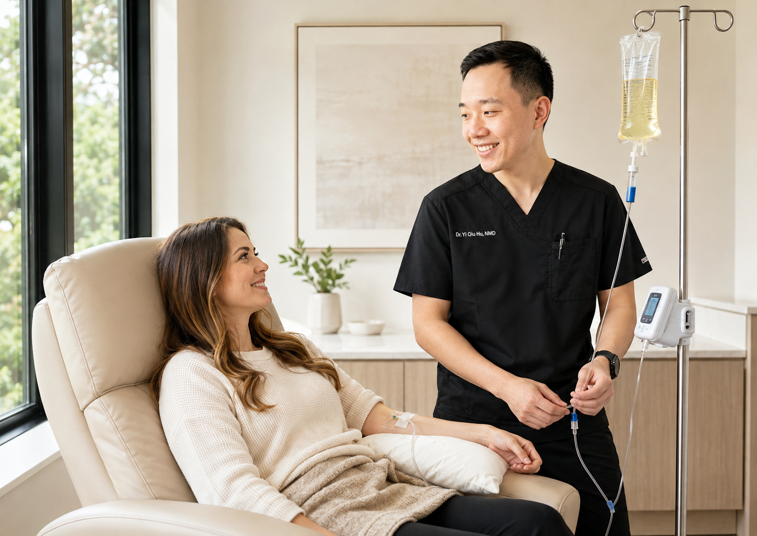 Patient receiving physician-monitored IV nutrient therapy while seated comfortably