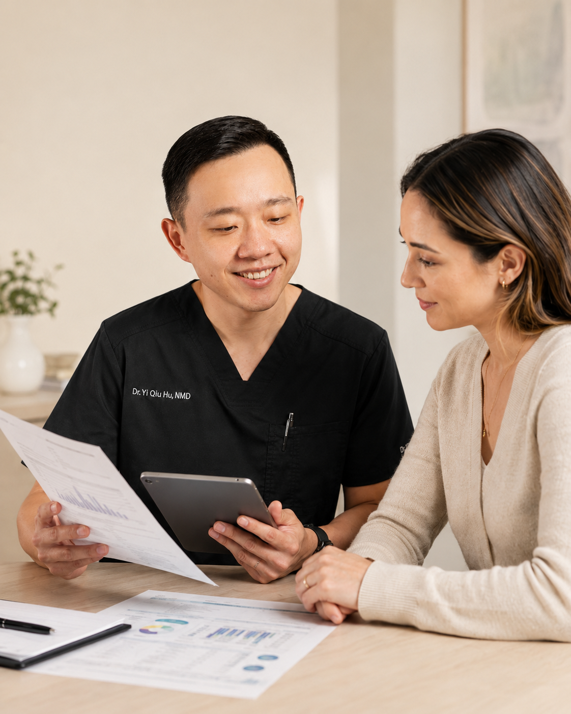 Dr. Hu reviewing specialty laboratory test results with a patient in Arizona