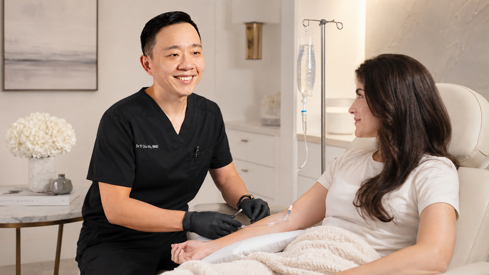 A healthcare professional drawing blood from a woman patient in a clinical setting.