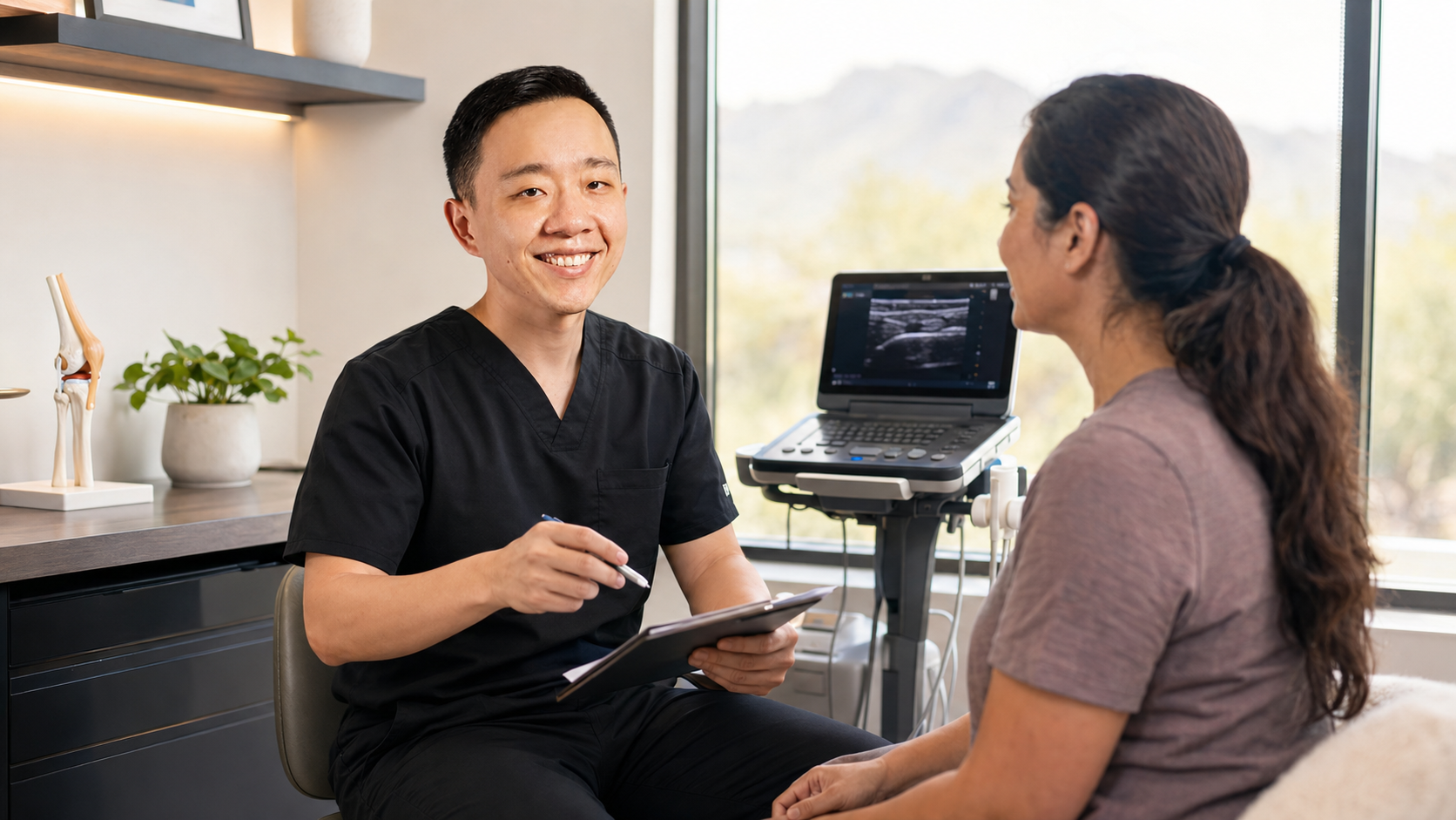 Physician performing an ultrasound-guided musculoskeletal evaluation for personalized pain management