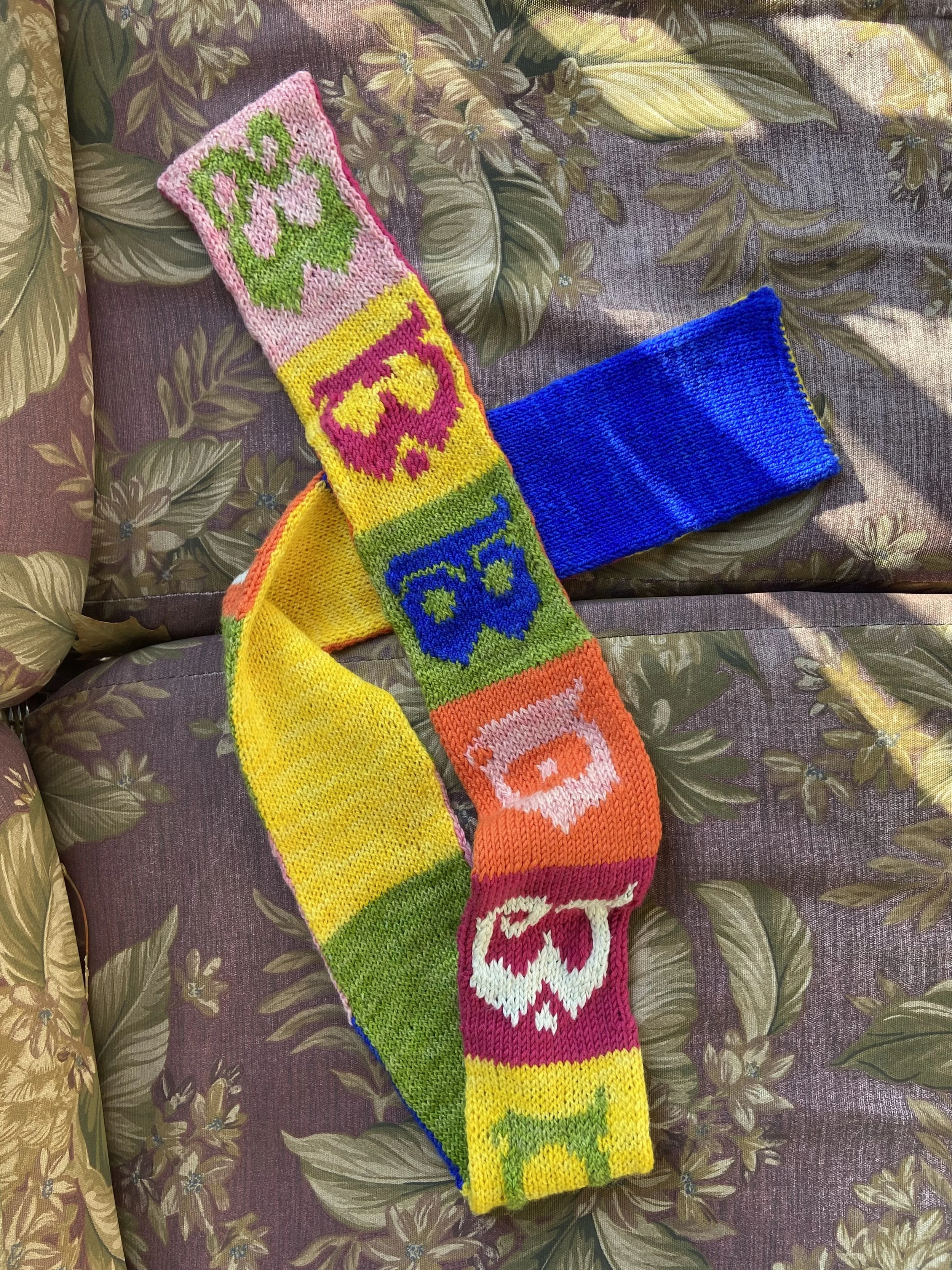 Scarf designed with custom typeface created by Zenab Bastawala. Hand dyed yarn with Holi powder