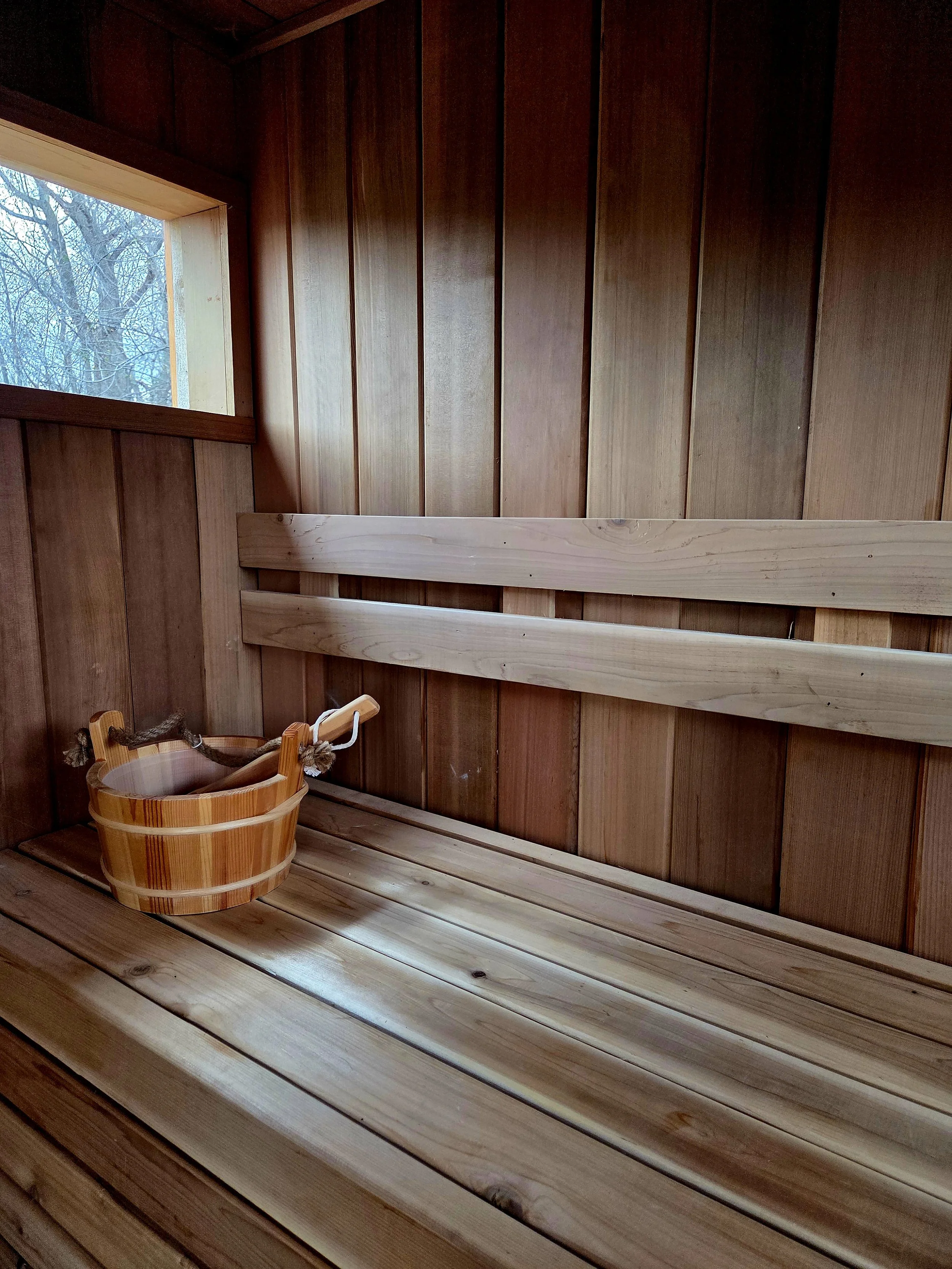 Sauna interior with clear western red cedar siding.