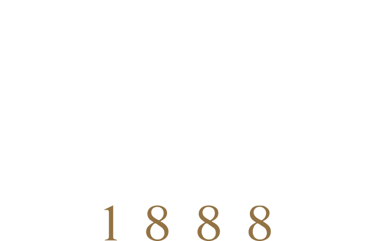 The image shows a black background with the text 'The Table 1888' in white and brown, stylized with the letter 'T' and the words 'The' and 'Table' arranged in a creative layout.