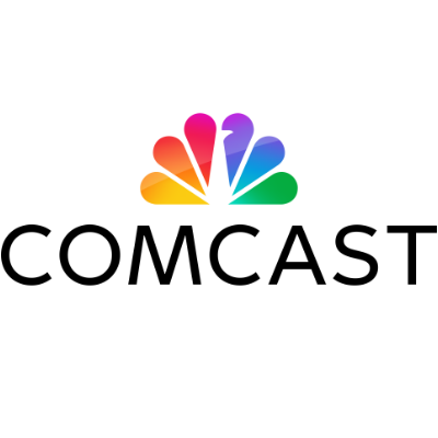 Colorful rainbow gradient shapes overlapping in a fan pattern with COMCAST underneath in black letters