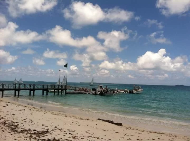 Island Paradise (lagoon, dock, sailboats)
The lagoon beach in Diego Garcia, where I was stationed. Water like this made the distance from home a little easier to sit with.