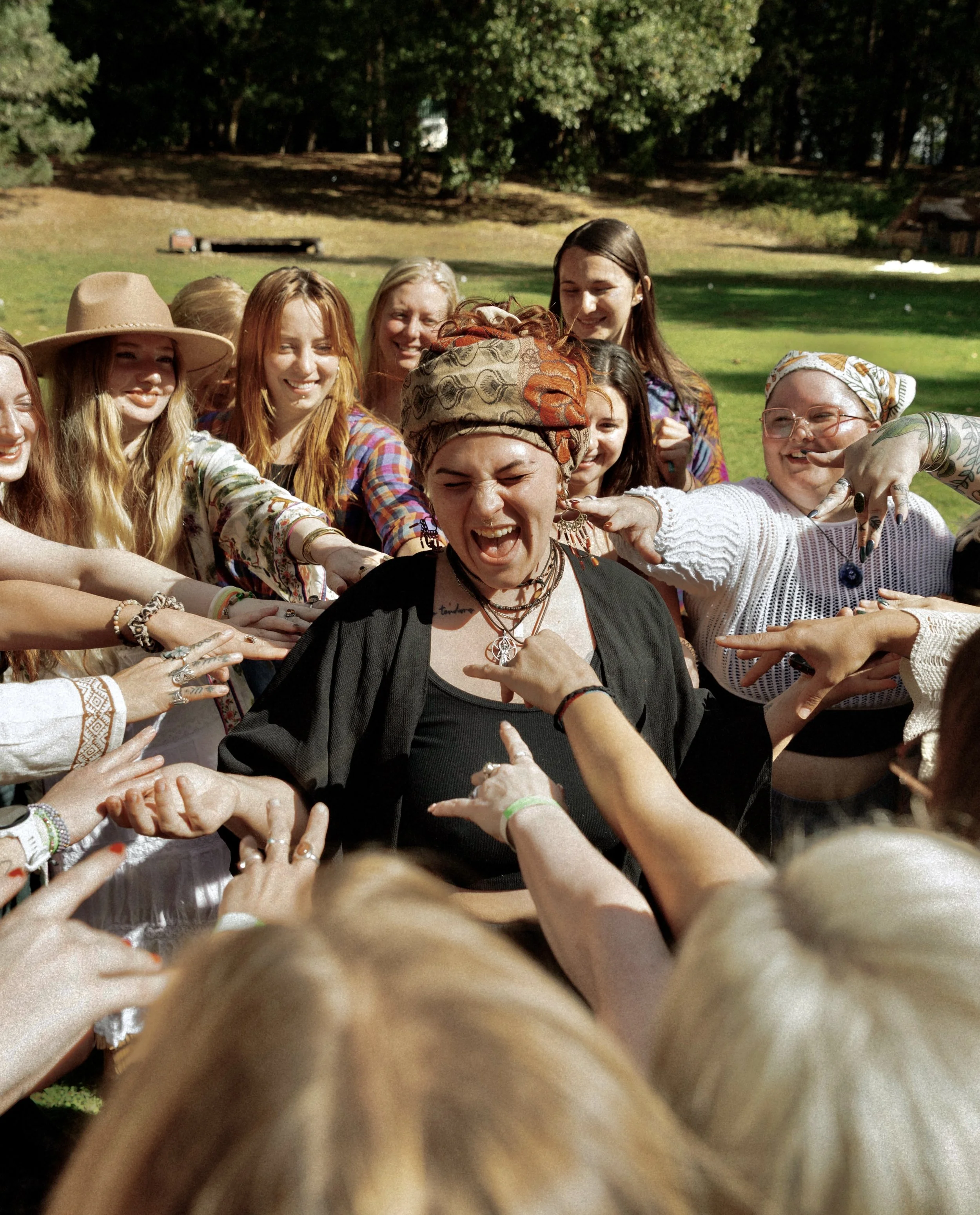A group of women at a retreat celebrating and giving back to their massage therapist.