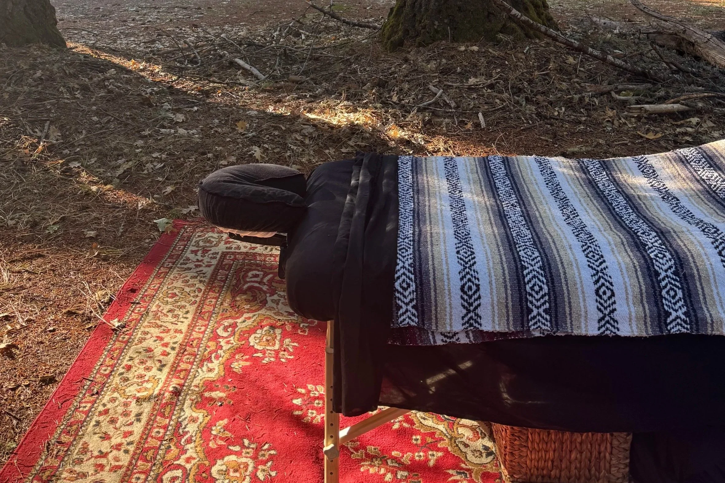 Outdoor mobile massage table in the forest.