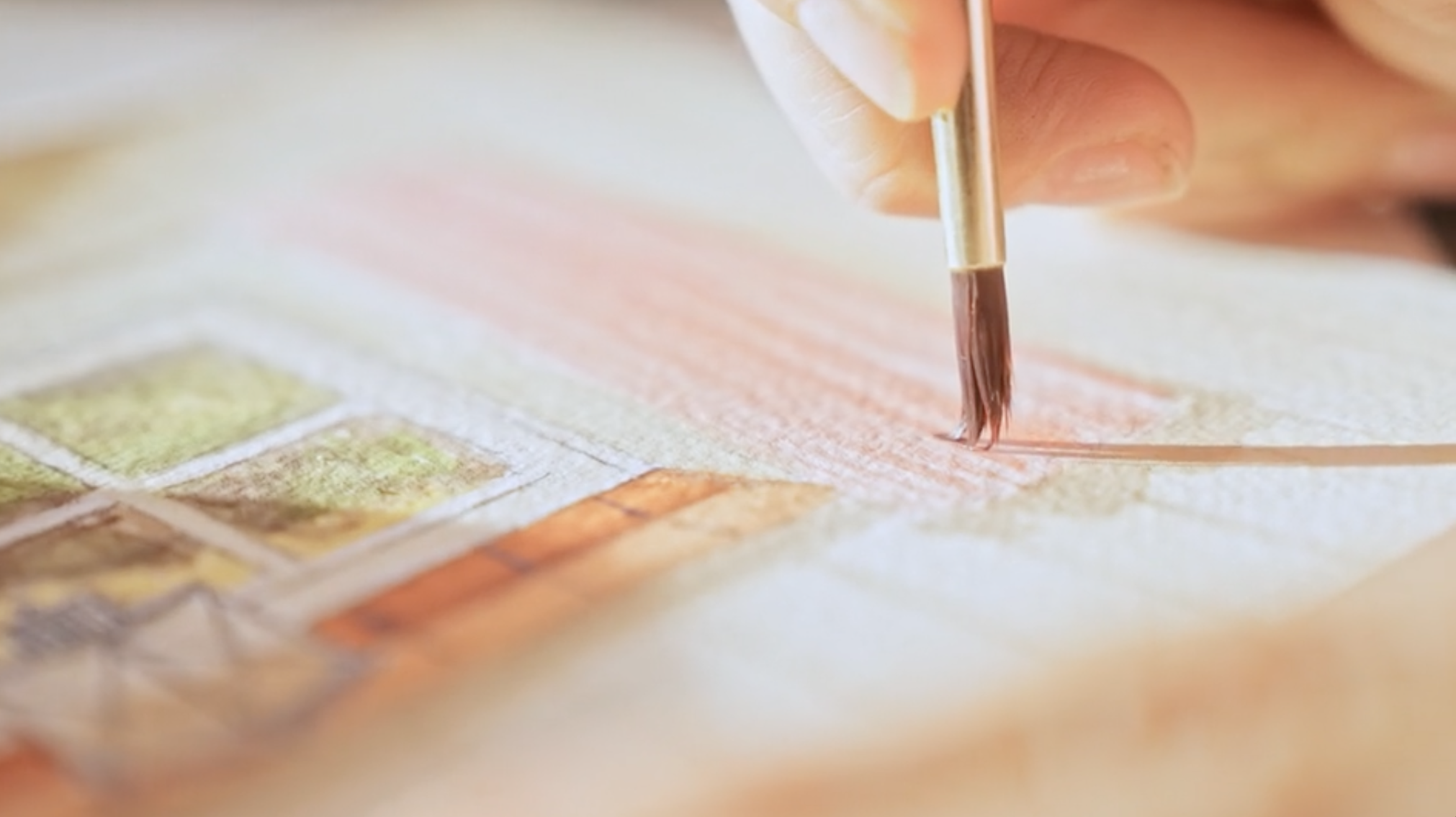 From above hands of unrecognizable woman rubbing aromatic spices into piece of raw meat over parchment paper