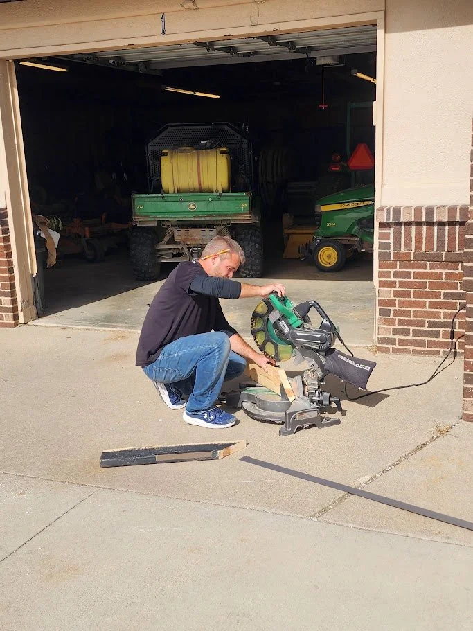 Brett BACES owner using a saw.jpg