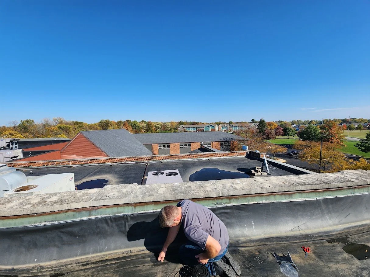 BACES owner doing commercial roof repair.jpg