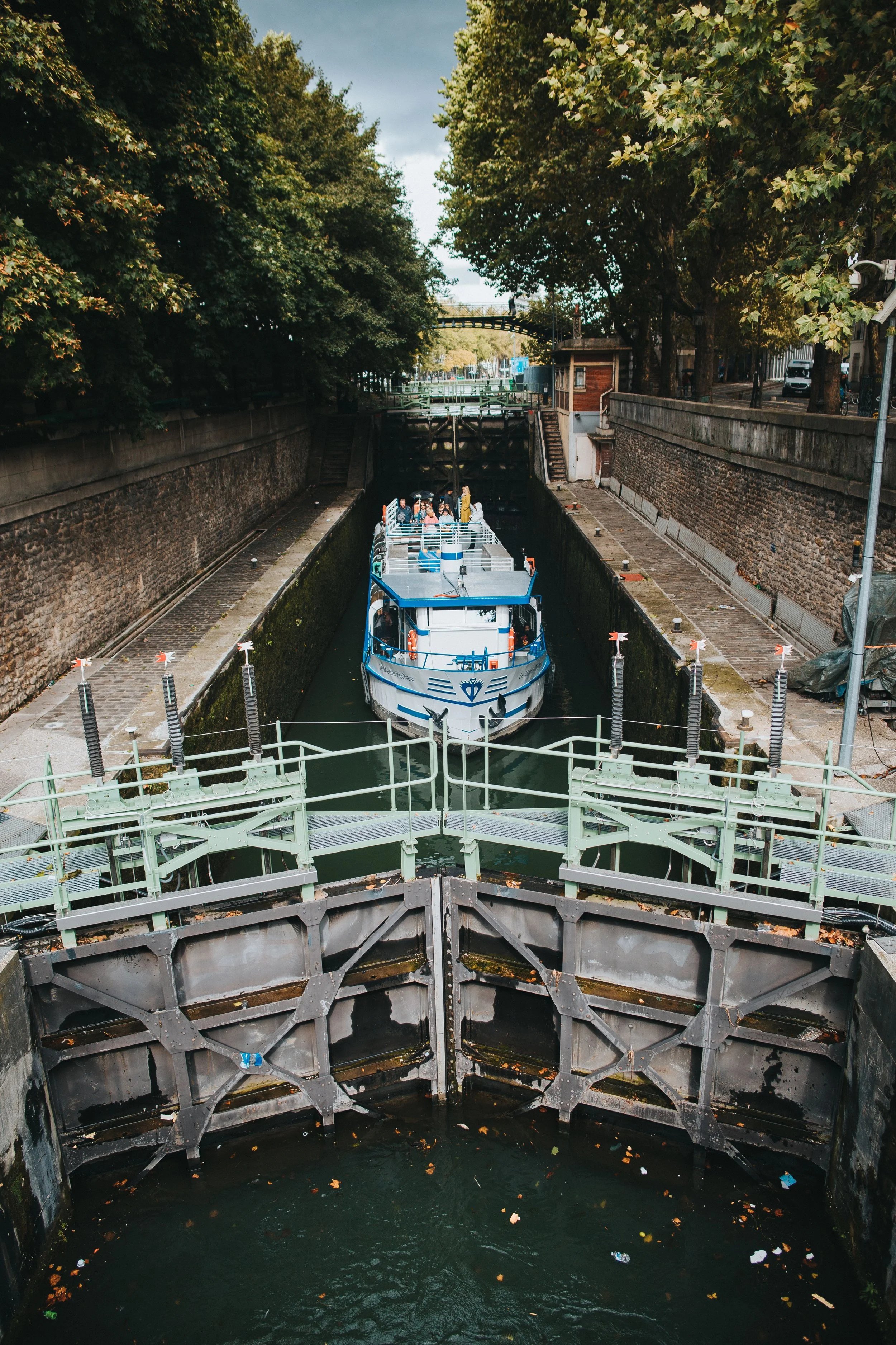 boat in the locks at the canal saint-martin Paris