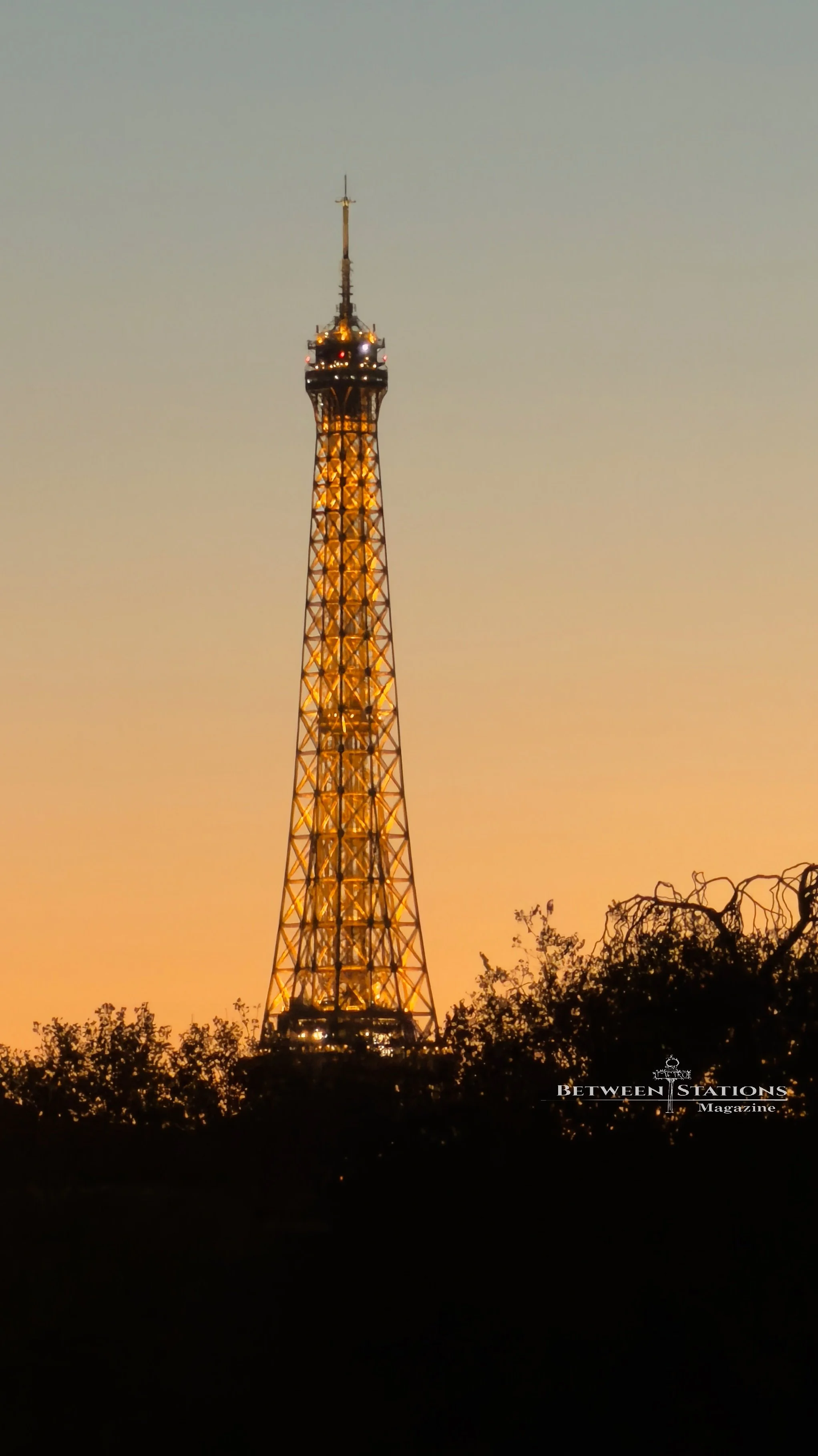 View of the iconic Eiffel Tower in the distance the Paris sunset