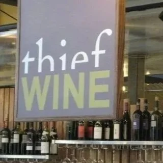 Sign reading 'Thief Wine' displayed inside the Milwaukee Public Market in the Historic Third Ward of Milwaukee, Wisconsin