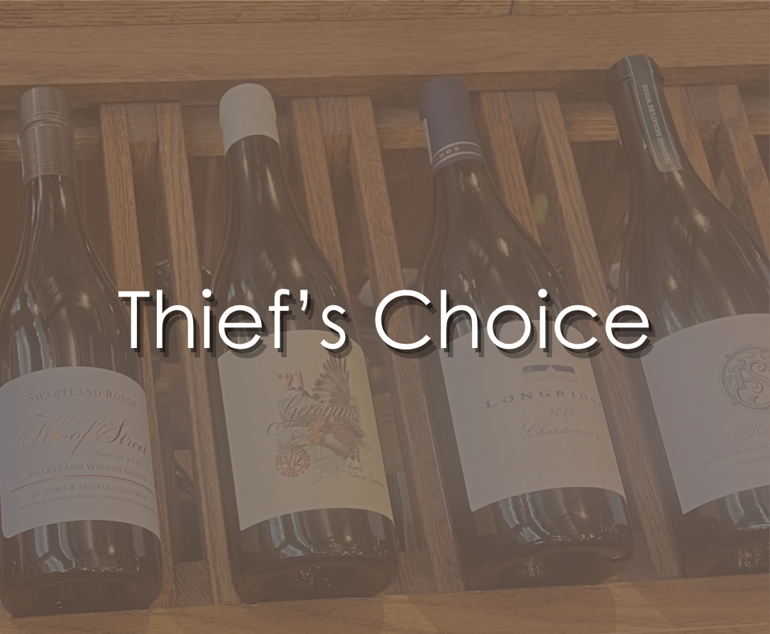Four bottles of wine stored on a wooden wine rack at Thief Wine with the text "Thief's Choice" overlayed.