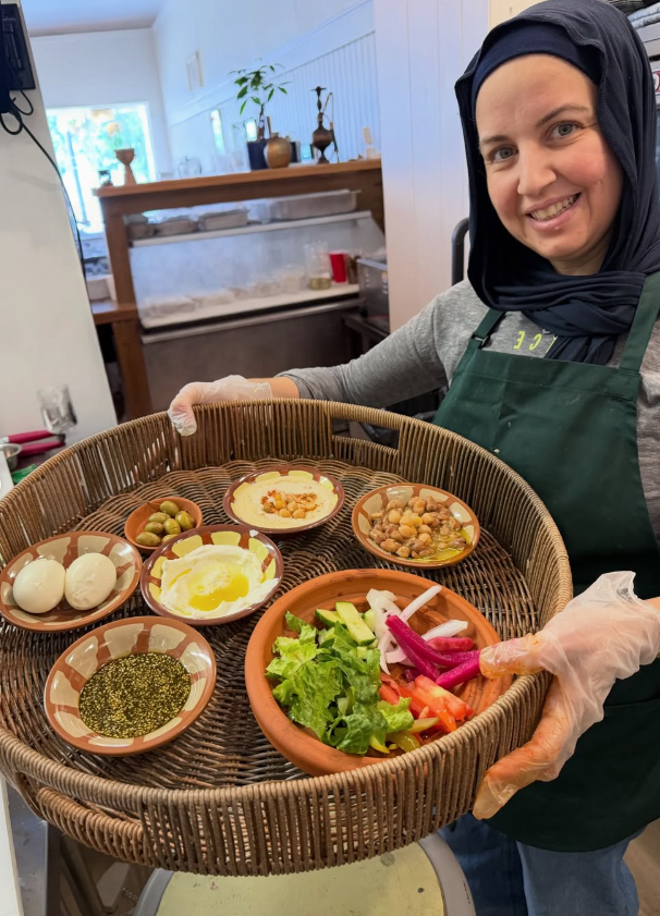 Maya preparing fresh ingredients for traditional Lebanese Terwi'aa breakfast at Shawbak in Melrose MA