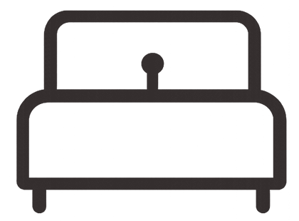 Line drawing of a bed with a headboard and a small object in the center of the headboard.