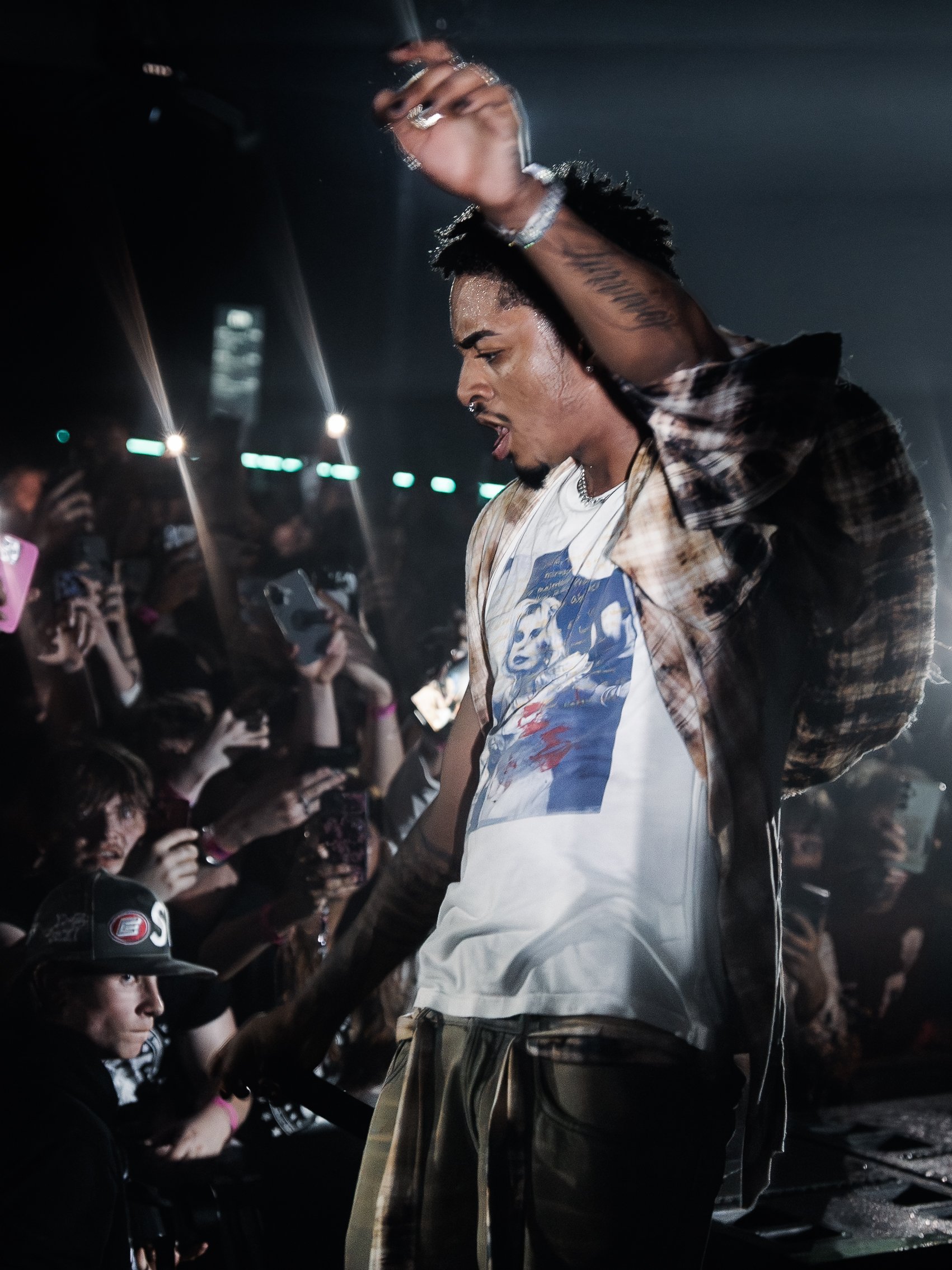 UK rap artist SINN6R delivering a live stage performance