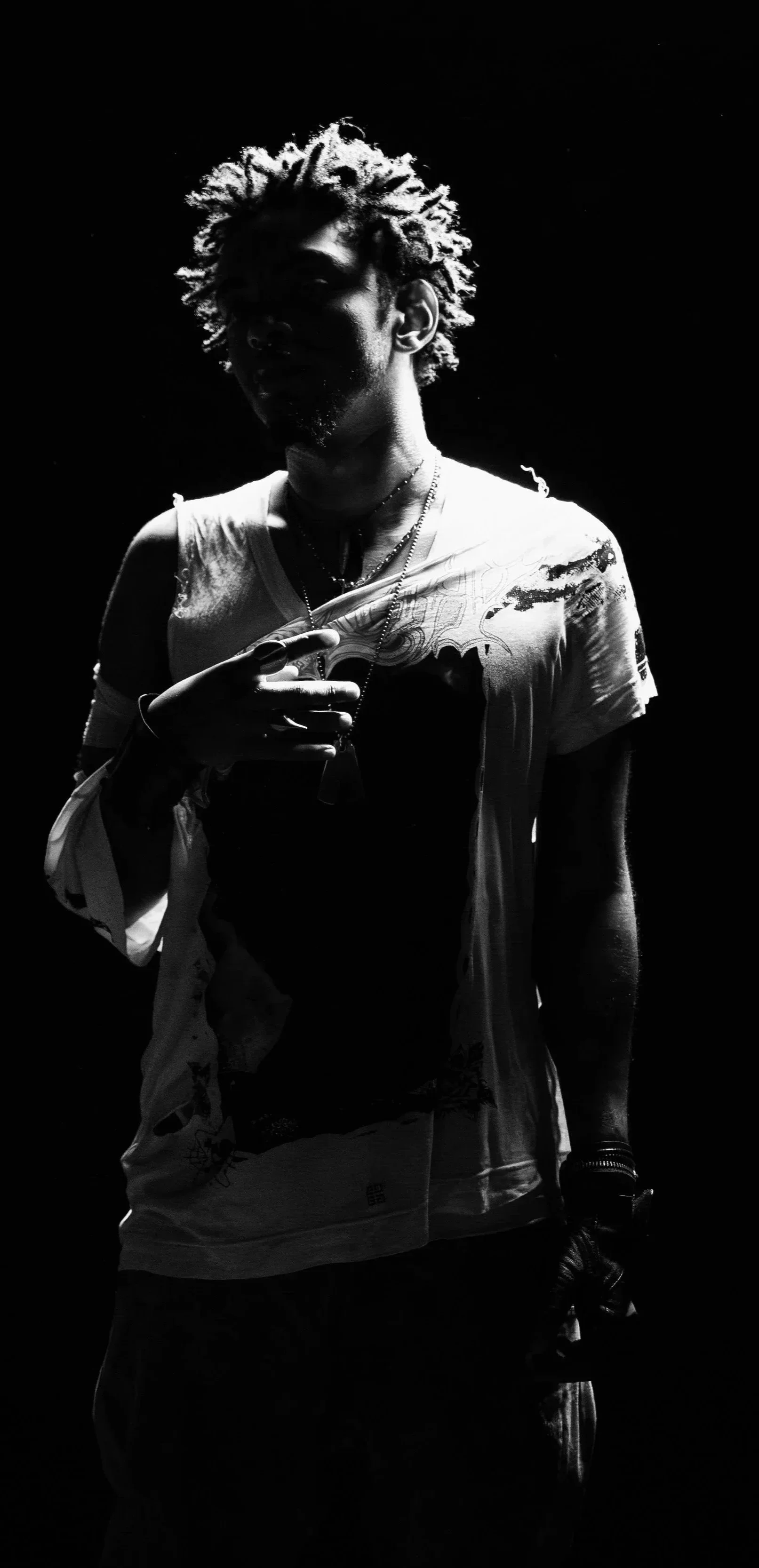 Black and white portrait of UK rap artist SINN6R