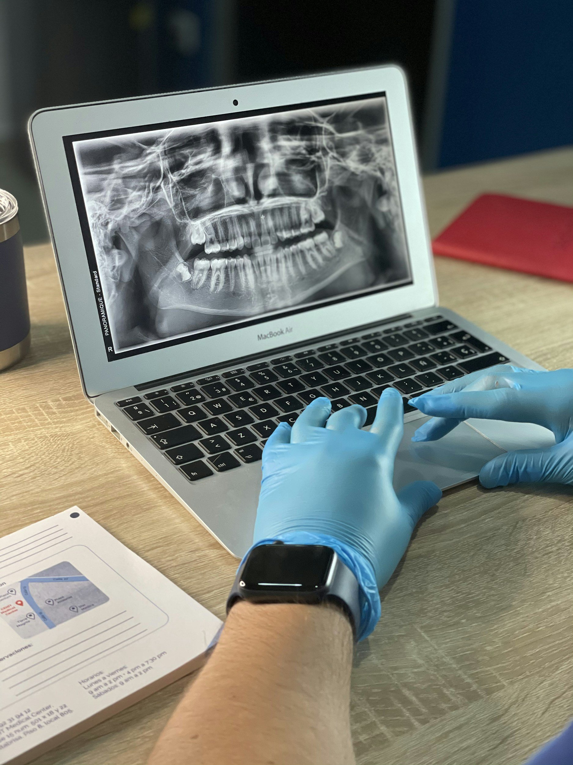 Xray taken as part of the teeth cleaning and notes being taken by the dental hygienist