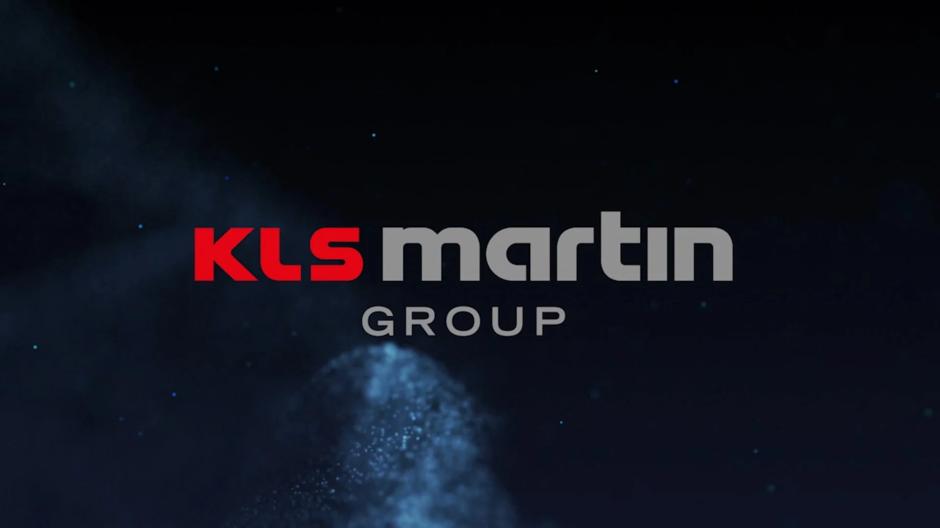 KLS Martin Group logo on a dark background with blue particles and light effects.