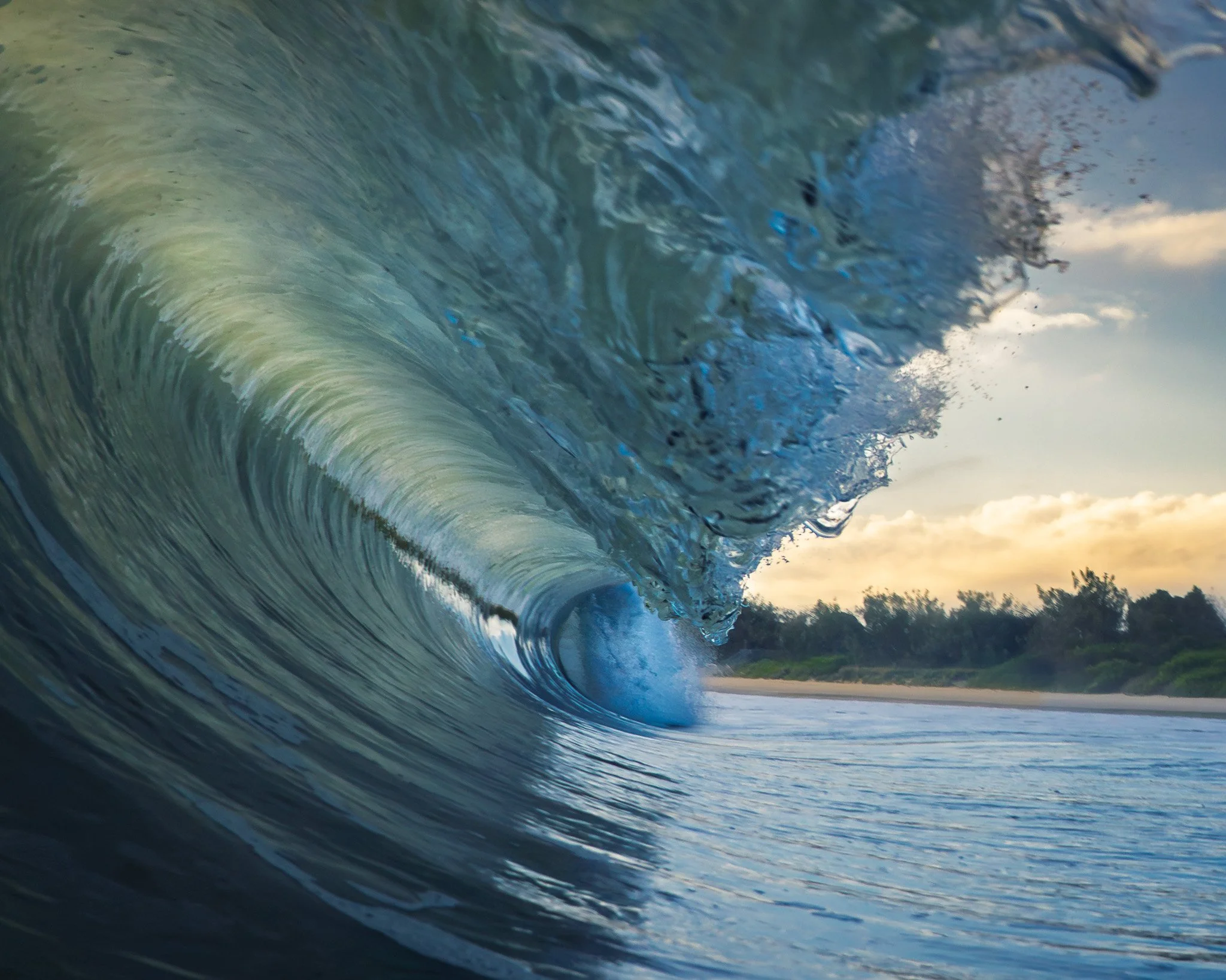 Gorgeous light at sunrise at Mooloolaba, the lip of this wave feels like a dragons head.